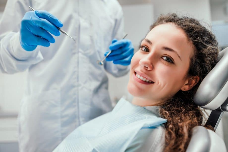woman in dental chair correlation between oral and overall health