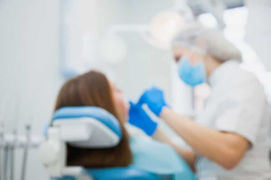 blurry photo of patient in dental chair
