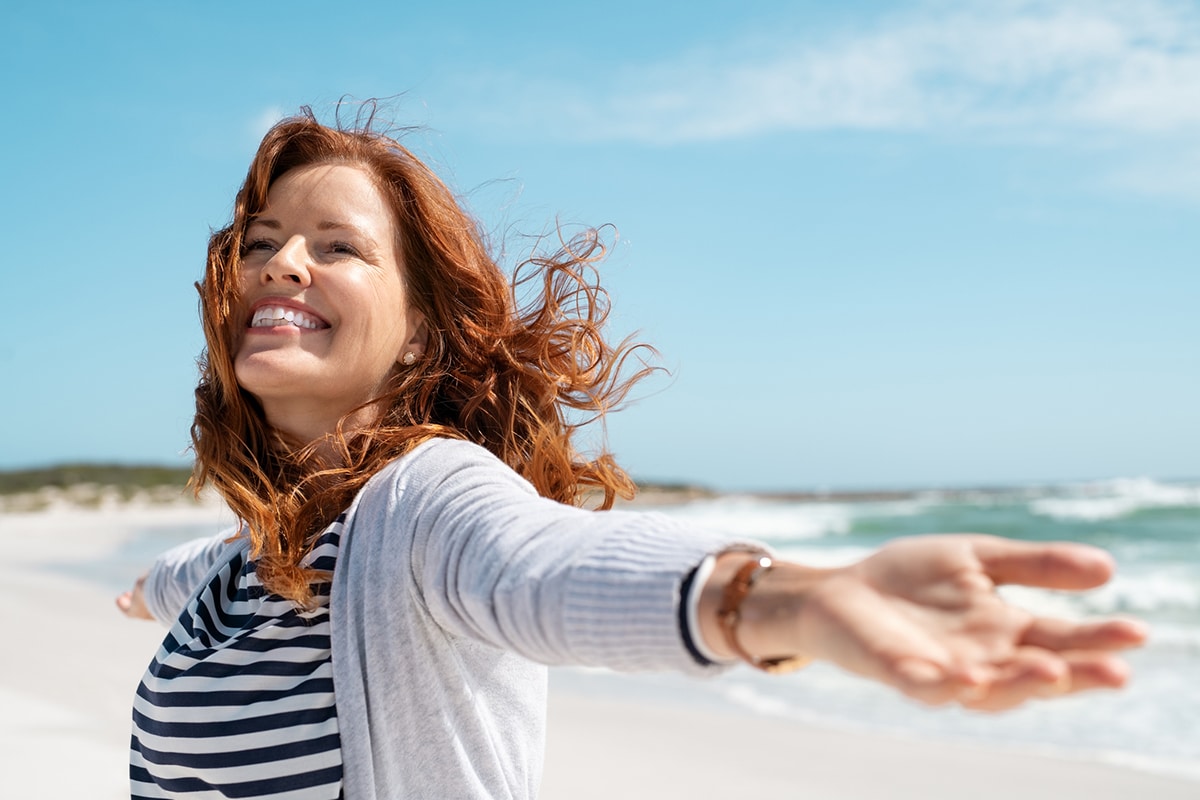 carefree woman at the beach