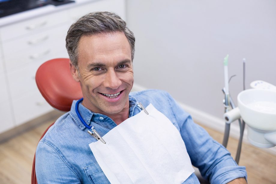 man smiling in dental chair